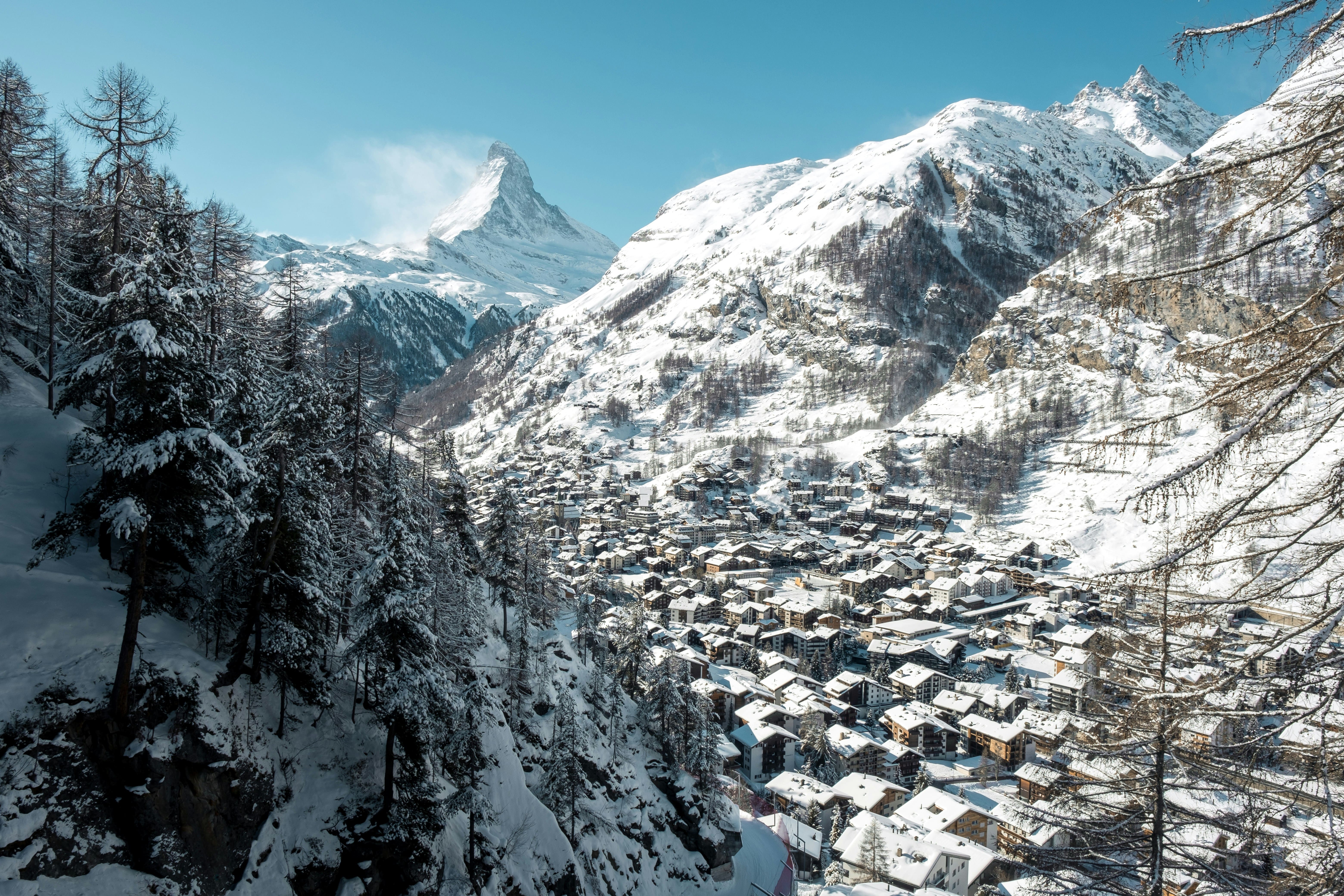 Family skiing with the Matterhorn behind them